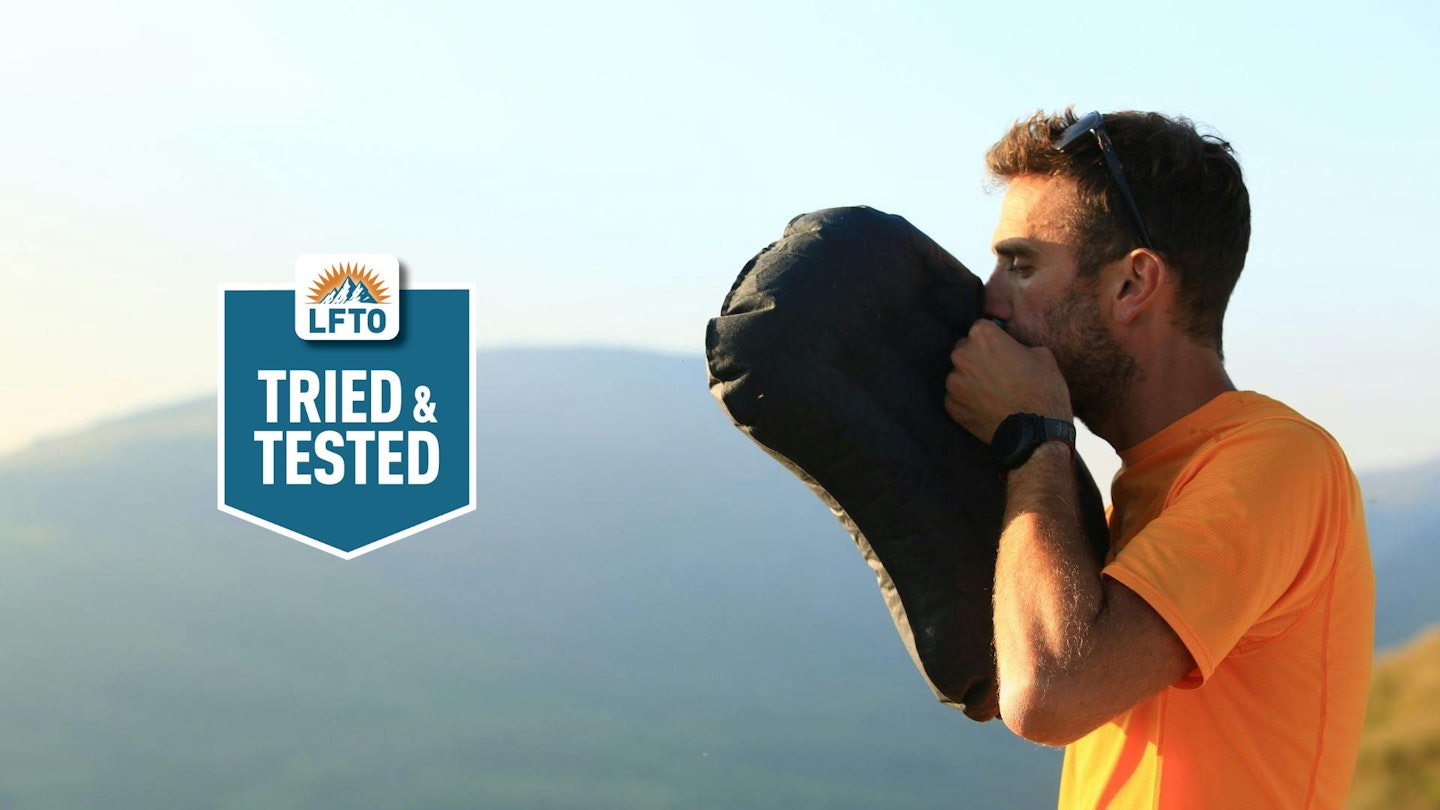 Image of Oli Reed blowing up a camping pilllow