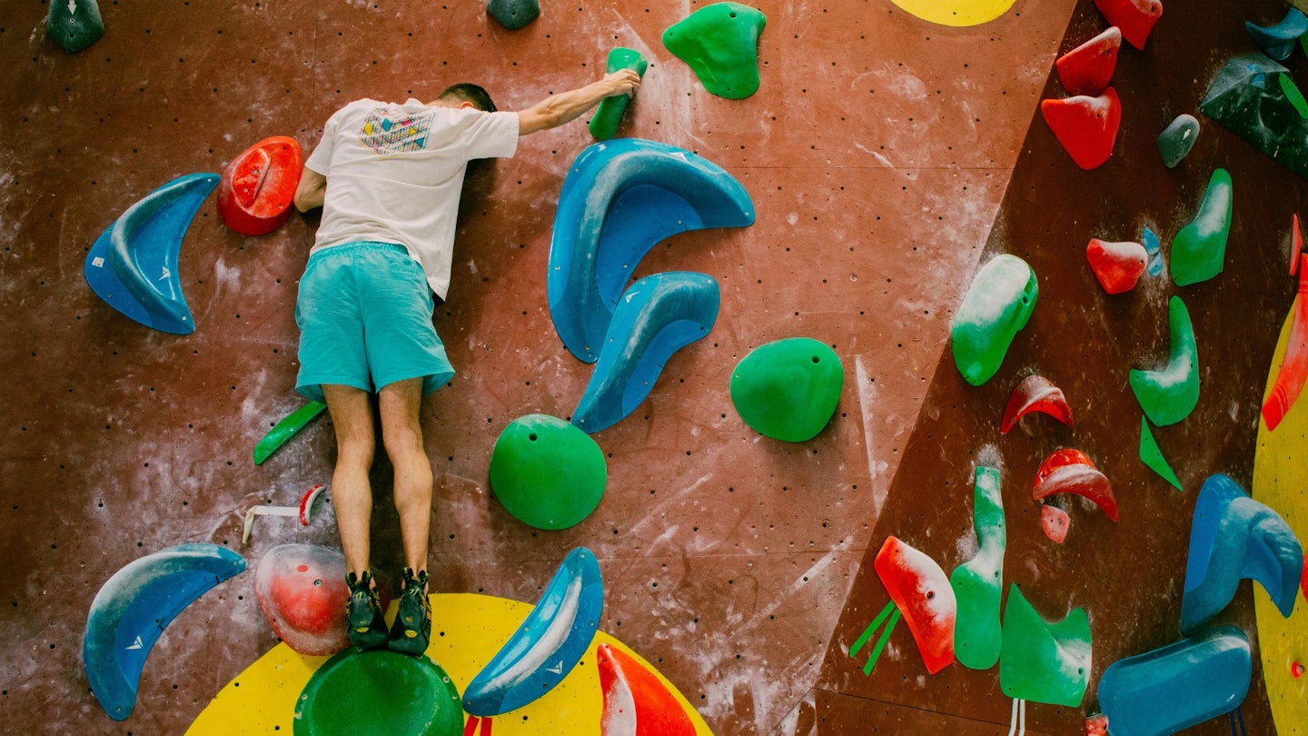 Climber at an indoors bouldering wall