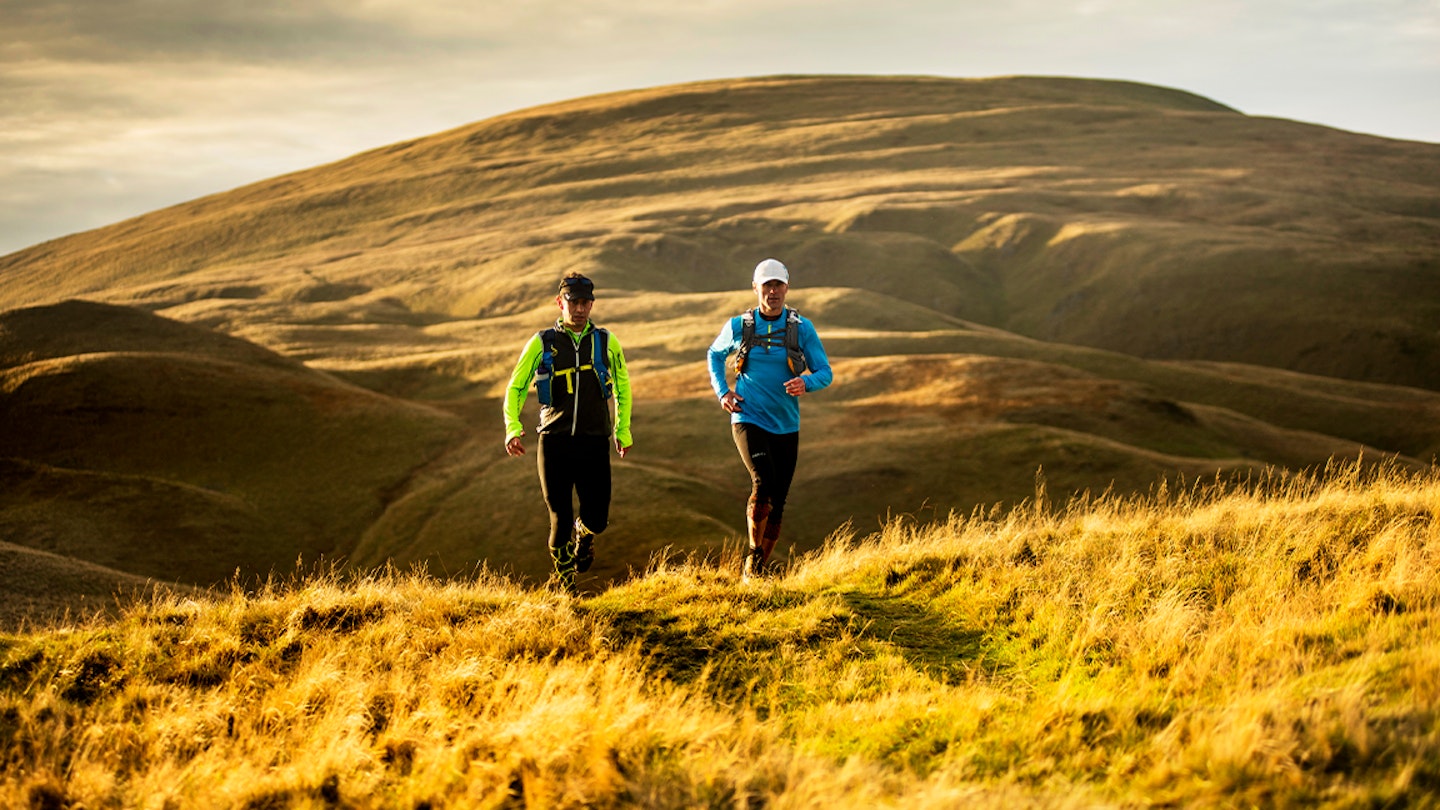 two runners on the fells and hills